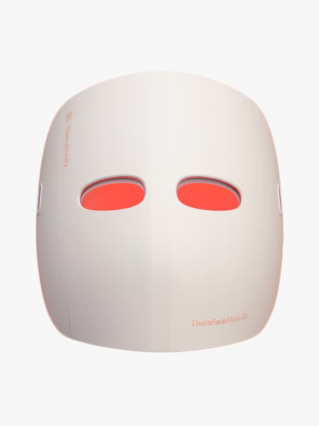 Therabody TheraFace Mask Glo in branded component on a light gray background